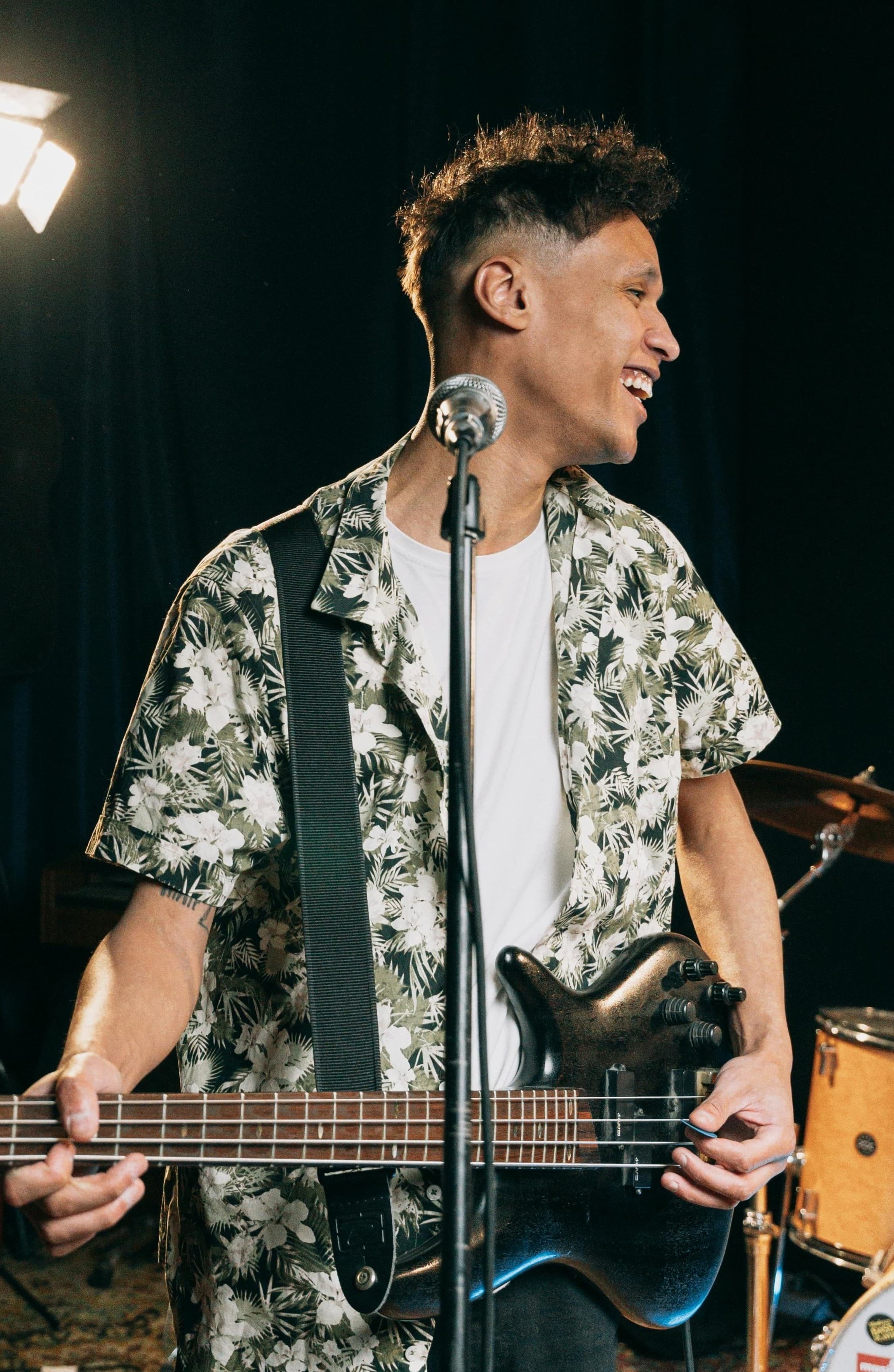 Student musician performing with a guitar